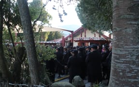 Māori Wardens are welcomed onto Turangawaewae Marae.