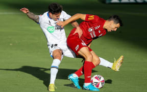 Isaias of Adelaide United is tackled by Felipe Gallegos of Auckland FC during the A-League Men Round 14 match between Adelaide United and Auckland FC at Coopers Stadium in Adelaide, Wednesday, January 22, 2025. (AAP Image/Matt Turner/Photosport)
