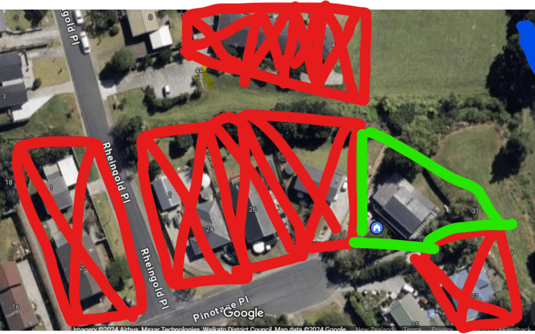 The Deacon family home in Huapai is considered category one following severe flooding of the street while their neighbours are all category three.