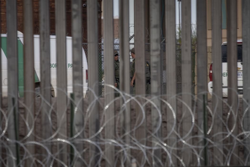 US Border Patrol agents patrol the Paso Del Norte International Bridge, where immigrants are crossing the Rio Grande between between Ciudad Juarez.