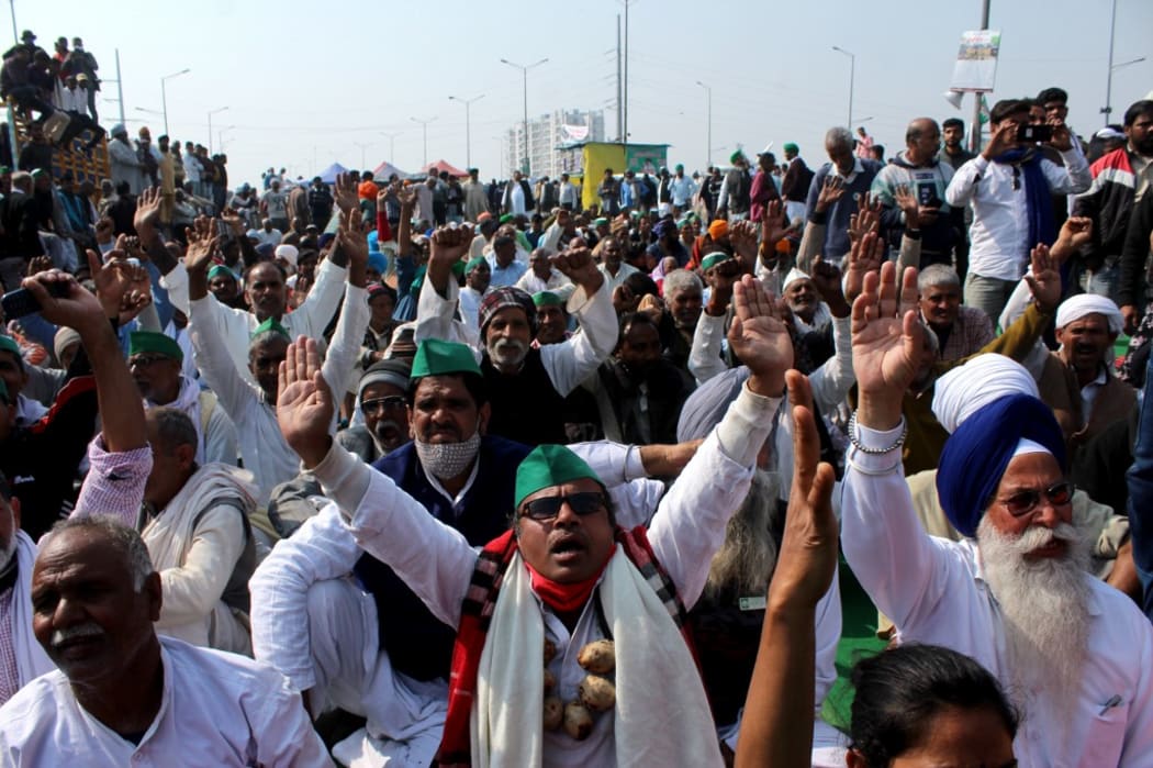 Farmers shout slogans during a demonstration against recent agricultural reforms at a blocked highway in Ghazipur on the outskirts of New Delhi.