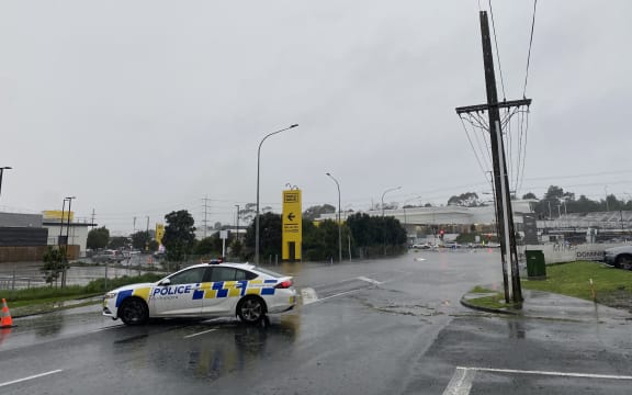 Porana Road closed at Wairau Road end due to flooding in Auckland on 9 May 2023.