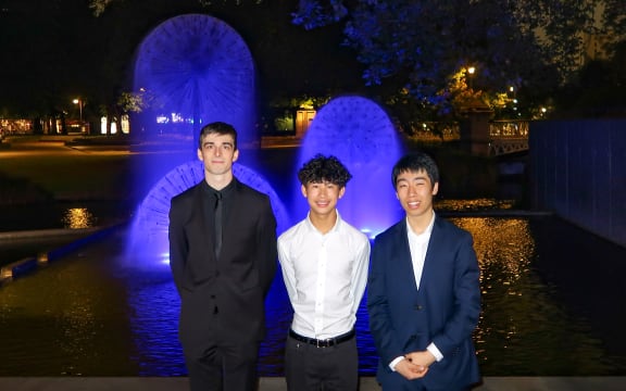 National Concerto Competition 2025 finalists Otis Prescott-Mason, Shan Liu and Henry Meng outside the Christchurch Town Hall.