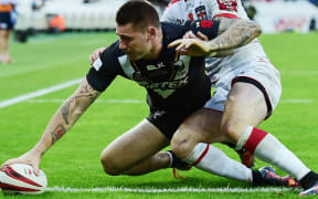 The Kiwis' wing Shaun Kenny-Dowall scores the game's only try.