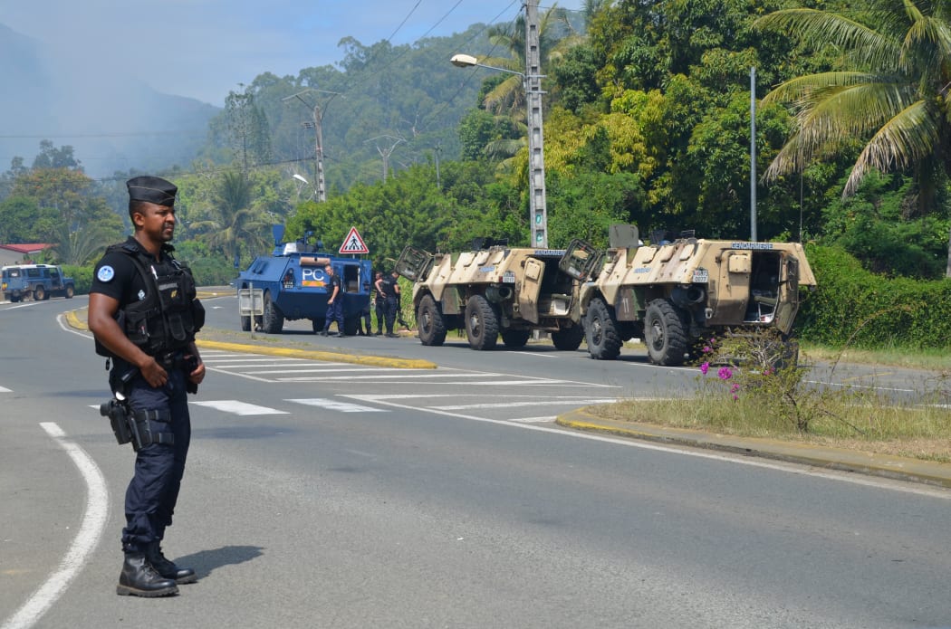Police on the blocked road south of Noumea near St Louis in New Caledonia