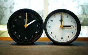28 March 2024, Berlin: Symbol photo on the subject of time change, winter time (CET), summer time (r). Photo: XAMAX/dpa (Photo by XAMAX / DPA / dpa Picture-Alliance via AFP)