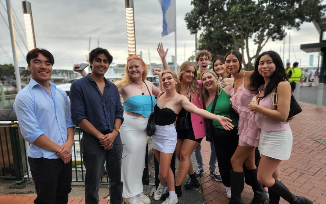 Friends gather at Auckland's waterfront.