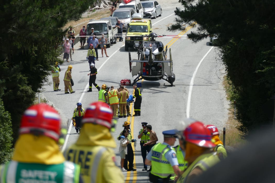 Emergency services at the scene of the crash on the Queenstown-Glenorchy Rd, near Queenstown, on Tuesday 21 January.