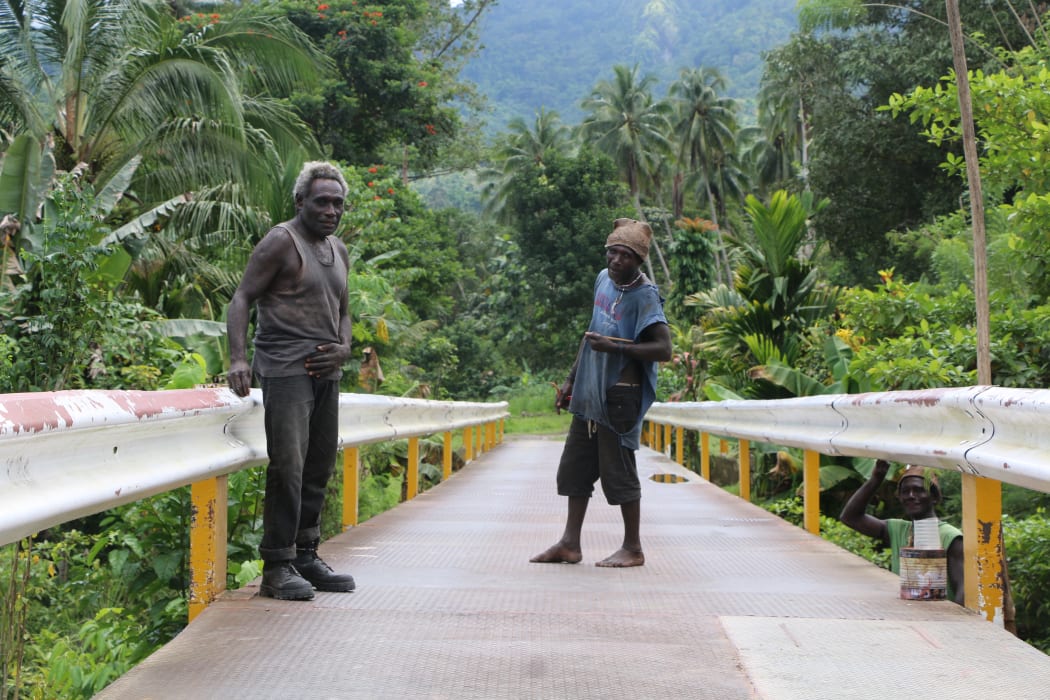 Chief Maia Tonjo (left) led his community in building a 67-metre bridge over the Tupukas River in Arawa, Bougainville.