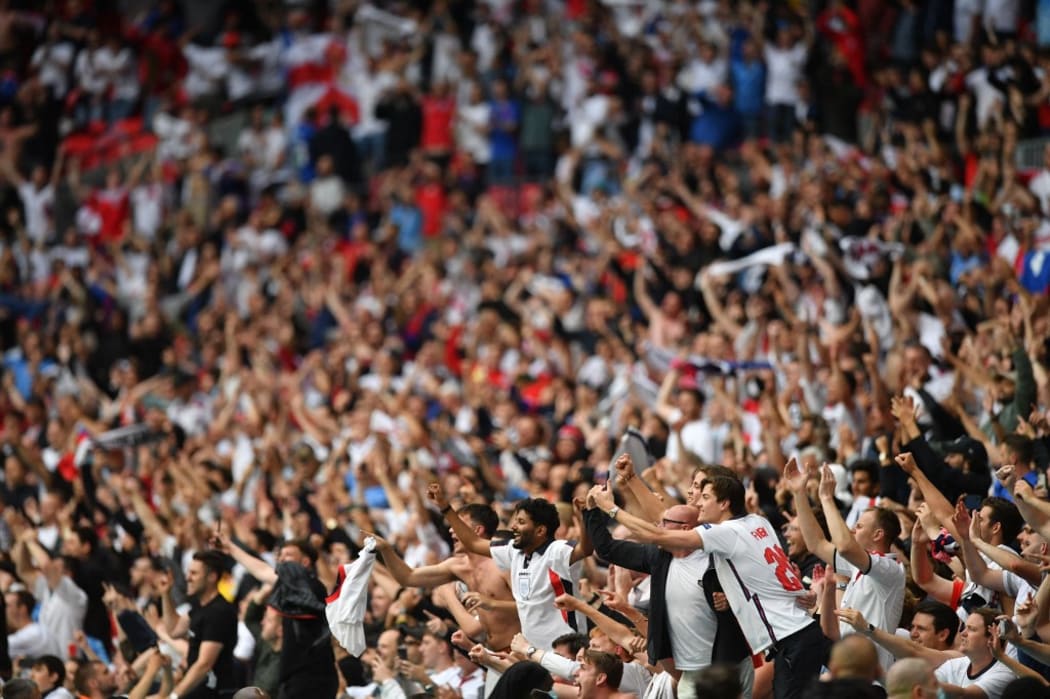 England supporters celebrate their win in the UEFA EURO 2020 round of 16 football match between England and Germany at Wembley Stadium in London on June 29, 2021.