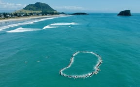 A paddle out was organised by Surfing NZ and Bay Boardriders tpay tribute to the six lives lost in the Mount Maunganui landslide.
