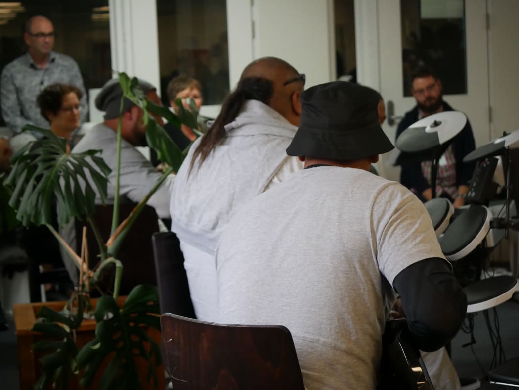 Members of the Christchurch Symphony Orchestra perform with prisoners