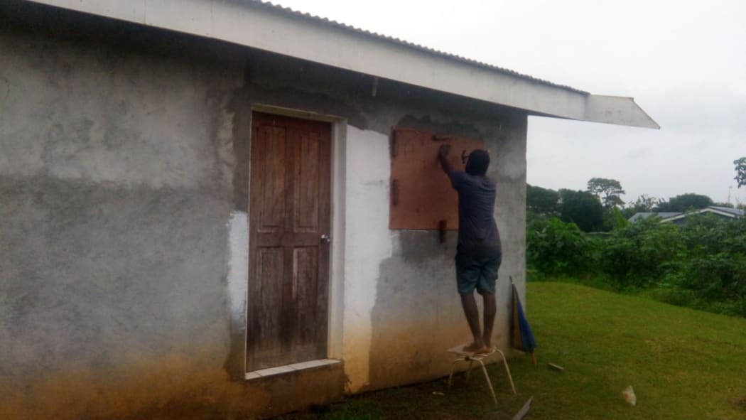 Residents board up houses in Vanuatu as Cyclone Harold nears.