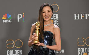 Malaysian actress Michelle Yeoh poses with the award for Best Actress - Motion Picture - Musical/Comedy for "Everything Everywhere All at Once" in the press room during the 80th annual Golden Globe Awards at The Beverly Hilton hotel in Beverly Hills, California, on January 10, 2023. (Photo by Frederic J. Brown / AFP)