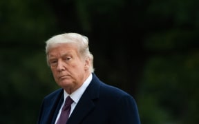 US President Donald Trump walks from Marine One after arriving on the South Lawn of the White House in Washington, DC, October 1, 2020, following campaign events in New Jersey