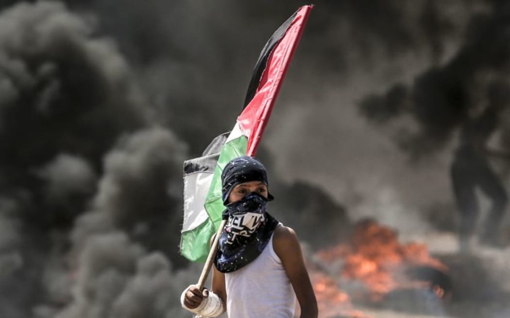 A Palestinian during clashes with Israeli security forces near the border between the Gaza Strip and Israel east of Gaza City.