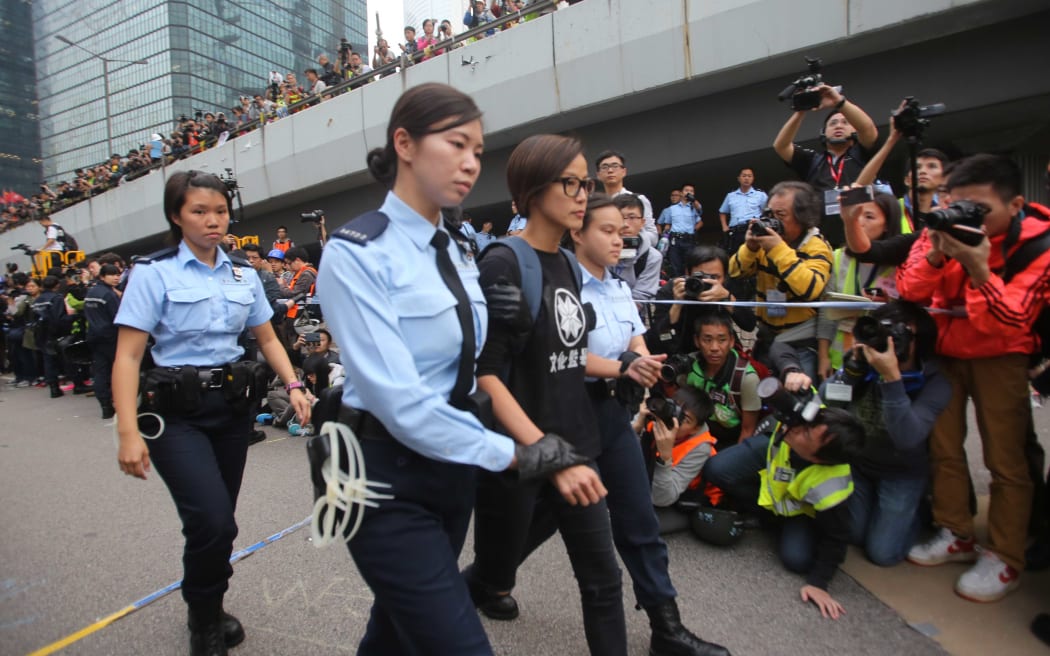 Singer Denise Ho Wan-See is arrested and removed during police clearance in central in Hong Kong.