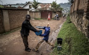 An automatic hand washing robot works to assist in the fight against Ebola. The ebola virus is spread through touch, and the use of the robot helps stop people from touching the same tap handles before and after washing their hands.