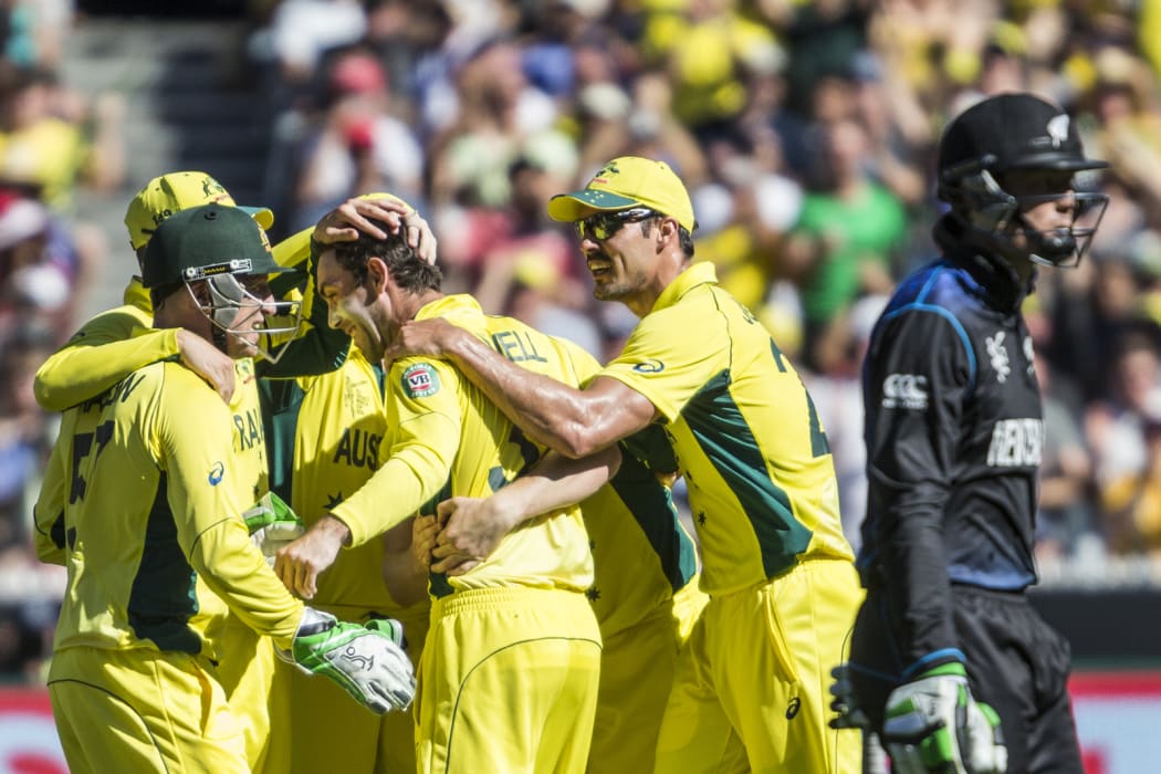 Glenn Maxwell and the Australian team celebrate after getting the wicket of Martin Guptill.