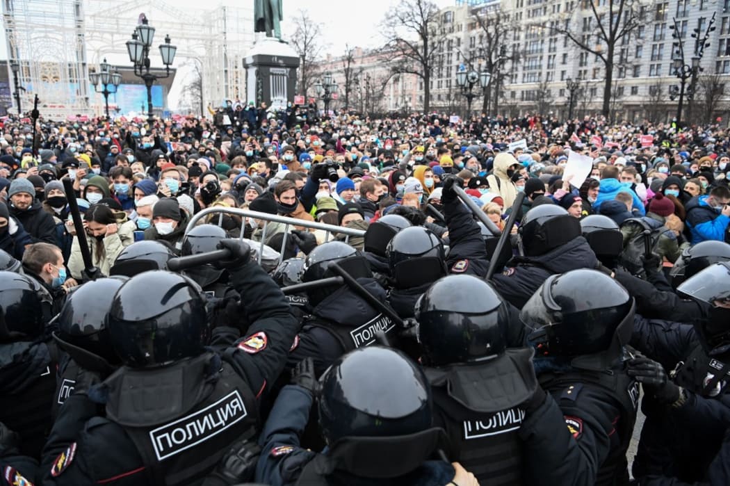 Protesters clash with riot police during a rally in support of jailed opposition leader Alexei Navalny in downtown Moscow on January 23, 2021.