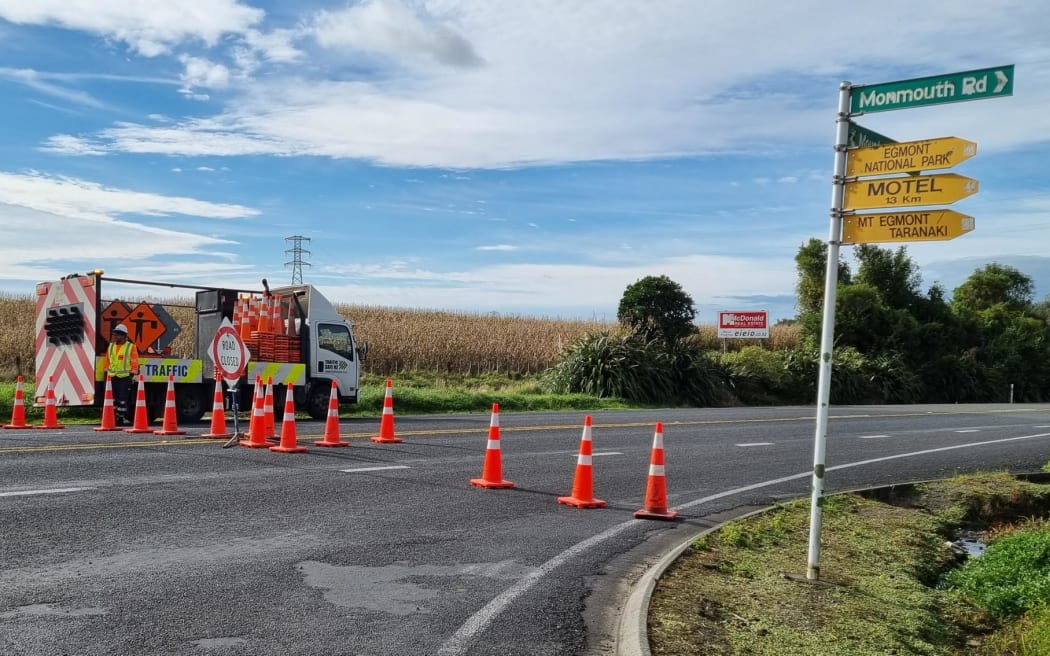 Traffic blocked at Stratford, Taranaki, as the Armed Offenders Squad talk to a man at a property after shots were fired at officers, 28 March 2023..