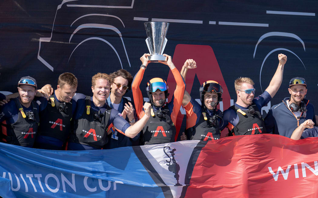 Britannia crew celebrate winning the 2024 Louis Vuitton Cup.