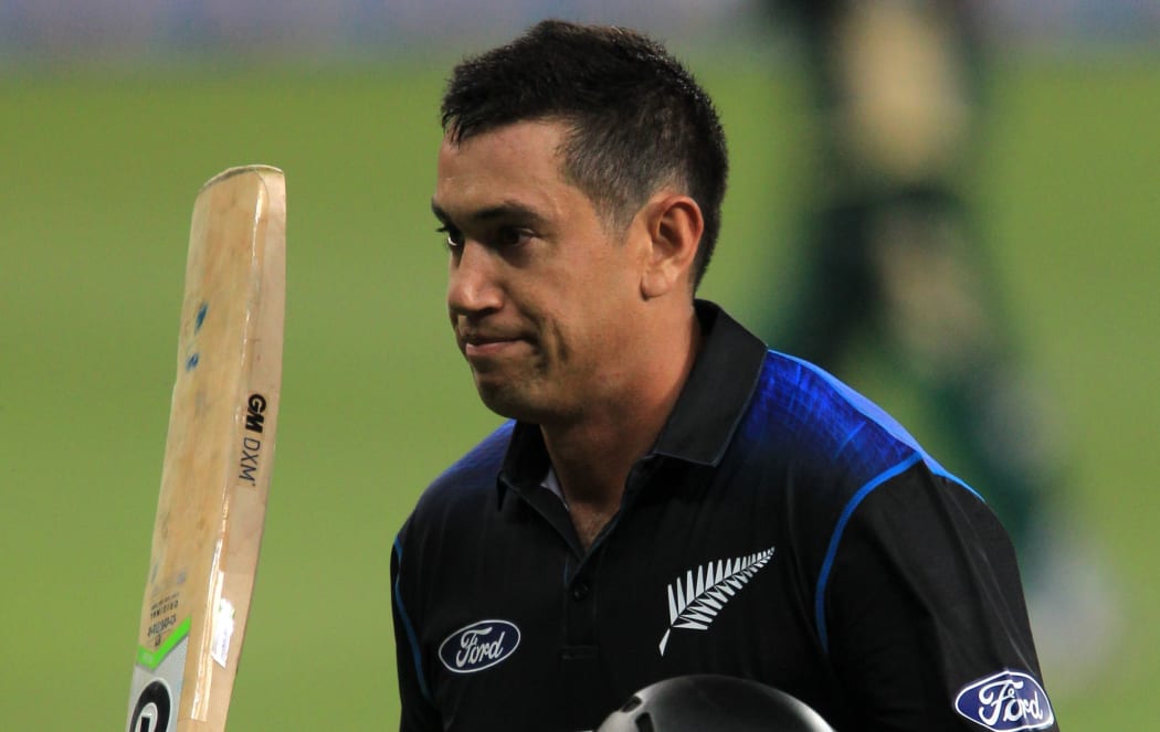 The Black Caps batsman Ross Taylor waves his bat on making his century.