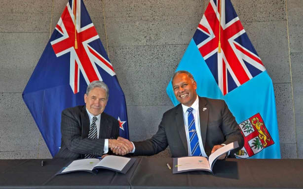 Fiji's Minister for Foreign Affairs and Trade Sakiasi Ditoka, right, with his New Zealand counterpart Winston Peters at the signing of the Duavata Partnership in Auckland.