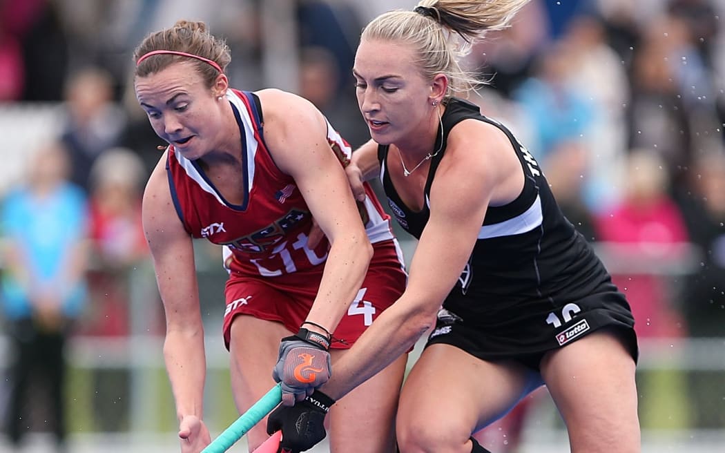 Liz Thompson of Black Sticks battles with Loren Shealy of USA.