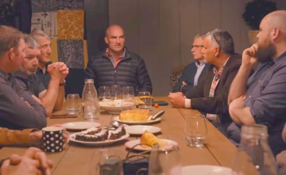 Baz MacDonald (right) sits down with Southland farmerss in 'Milk and Money.'