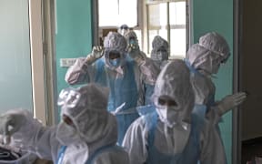 Doctors and nurses wearing Personal Protective Equipment (PPE) suits work at the Intensive Care Unit for Covid-19 coronavirus patients at the Sharda Hospital, India on July 15, 2020.