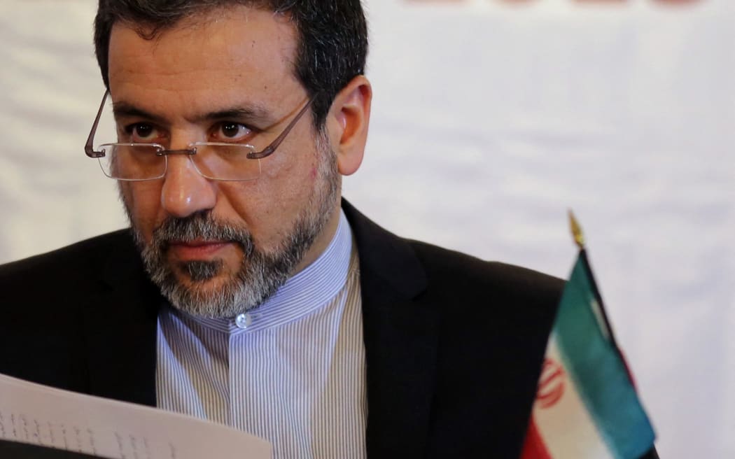 Iran's Deputy Foreign Minister Abbas Araqchi speaks during United Nations day in Tehran, on October 22, 2013. The United Nations Day is devoted to making known to peoples of the world the aims and achievements of the United Nations Organization and runs as part of the United Nations Week, from 20 to 26 October. AFP PHOTO/ATTA KENARE (Photo by ATTA KENARE / AFP)