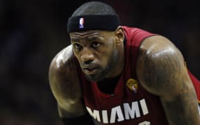 The Miami Heat's LeBron James pauses on the court during the first half against the San Antonio Spurs in Game 1 of the NBA Finals in San Antonio in June.