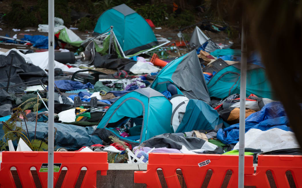 Tents and rubbish litter Parliament grounds after clashes between police and protesters yesterday.