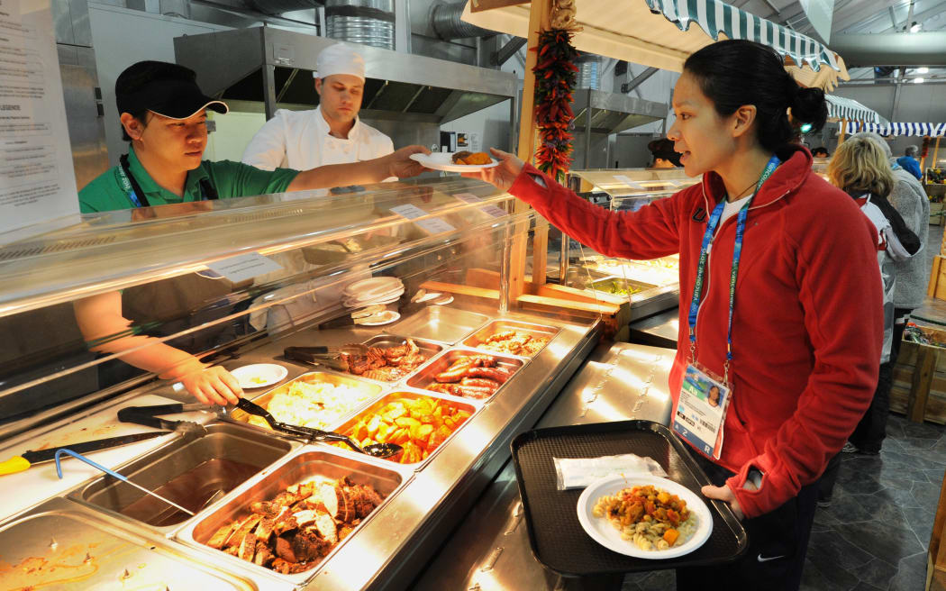 Athlete at an Olympic food hall.