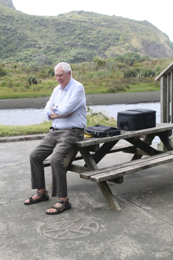 An image of Sir Bob Harvey, sitting on a picnic table outside the Clubrooms, keeping an eye on the drone's preparations.