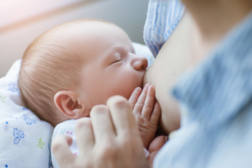 breastfeeding for newborns motherhood concept. helpful tips for feeding the baby. love and tenderness.