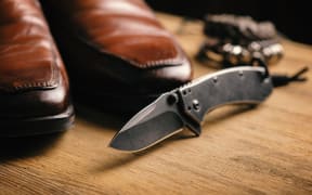 stainless steel pocketknife with blackwash finish on blade and handle
