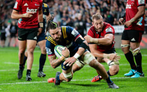 Highlanders' Elliot Dixon gets across the line during the Highlanders v Crusaders