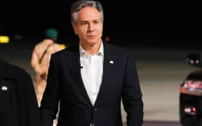US Secretary of State Antony Blinken walks on the tarmac at al-Ula airport in northwestern Saudi Arabia as he departs for Tel Aviv on January 8, 2024, during his week-long trip aimed at calming tensions across the Middle East. (Photo by EVELYN HOCKSTEIN / POOL / AFP)
