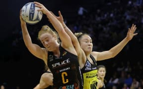 Magic captain Sam Winders (left) tussles with Pulse wing attack Whitney Souness