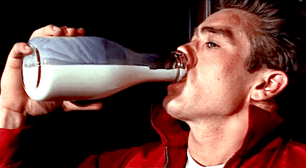 An animted gif of James Dean drinking from a glass bottle of milk