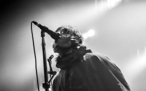 Photo of Liam Gallagher singing live