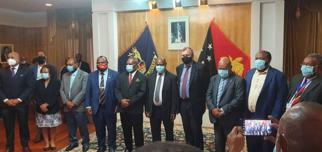 Members of the Papua New Guinea government and the mining company Barrick Gold attend a signing ceremony for their joint Porgera gold mine project.