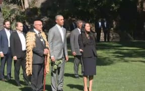 Barack Obama is welcomed to Government House.
