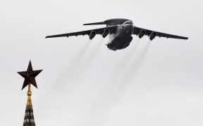 A Beriev A-50 early warning and control aircraft flies over the Kremlin and Red Square in downtown Moscow to mark the 75th anniversary of the victory over Nazi Germany in World War Two, May 9, 2020. (Photo by Yuri KADOBNOV / AFP)