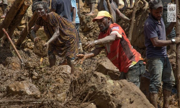 Villagers have been attempting to recover loved ones with their bare hands.