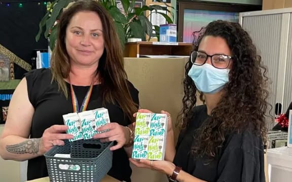Kōkiri Marae Sexual & Reproductive Health Promoter/Educator Shelley Duffin (left) holdin period care products.