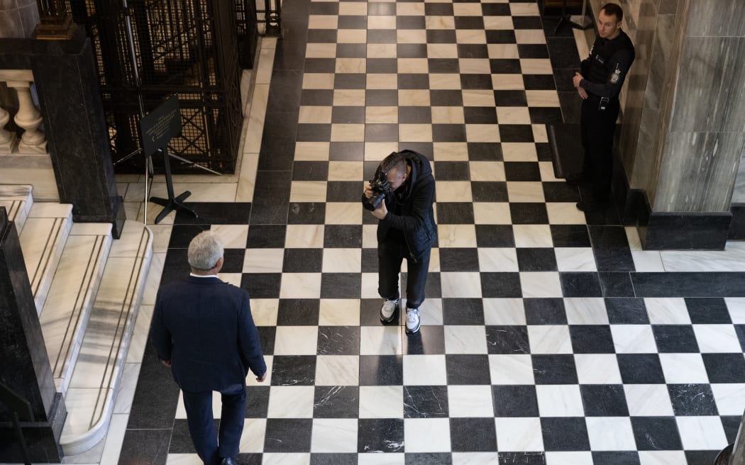 Rob Kitchin taking photos of Labour MP Stuart Nash on Parliament's 'Tiles'.