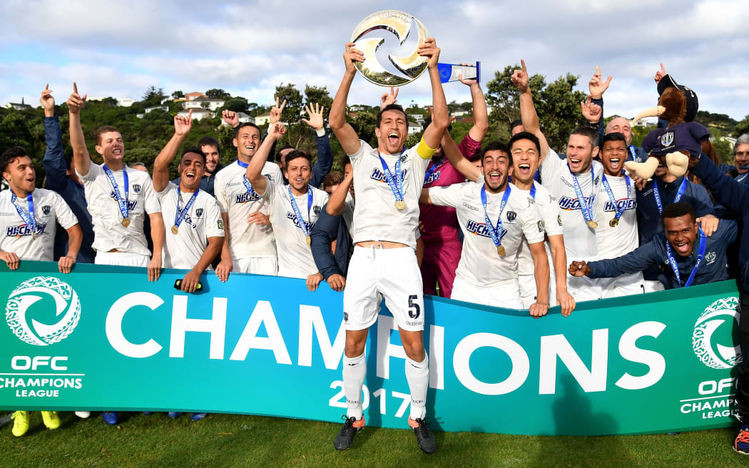 Auckland City FC captain Angel Berlanga holds aloft the OFC Champions League tropgy in 2017.